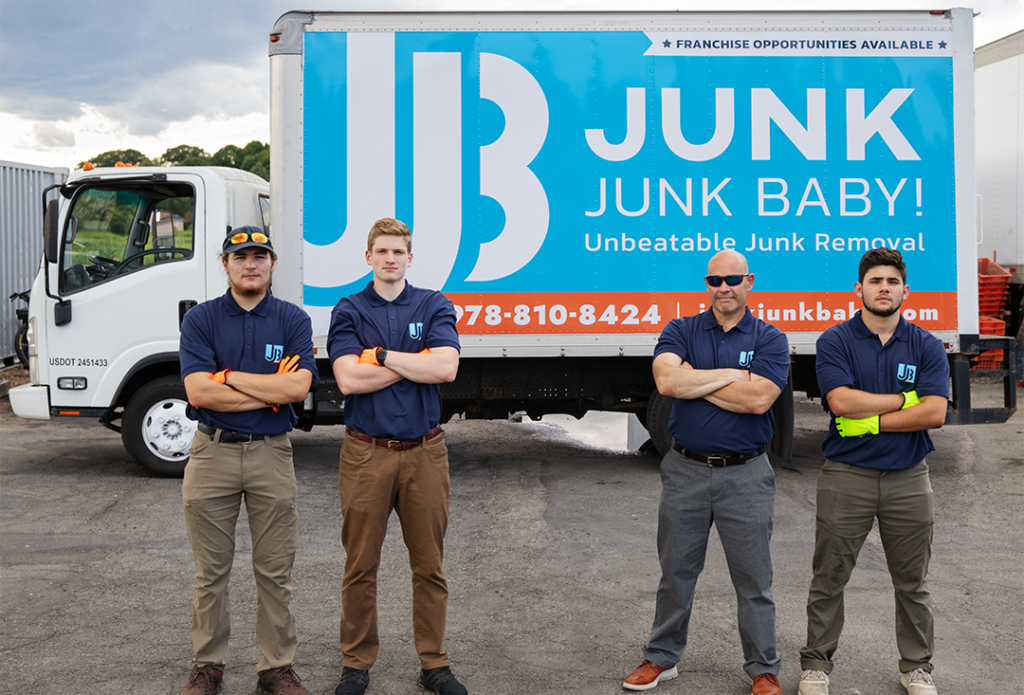 Junk Junk Baby team standing in front of truck